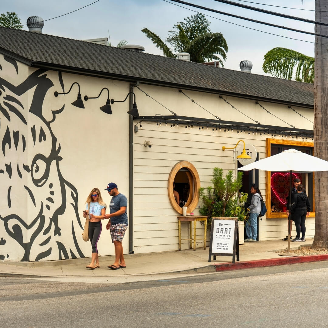 People walk outside Dart Coffee Company in Santa Barbara&rsquo;s Funk Zone.