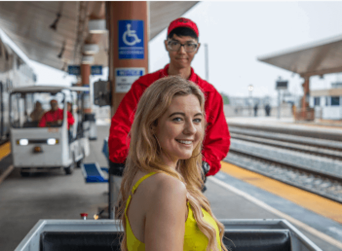 Red Cap attendant assisting passenger